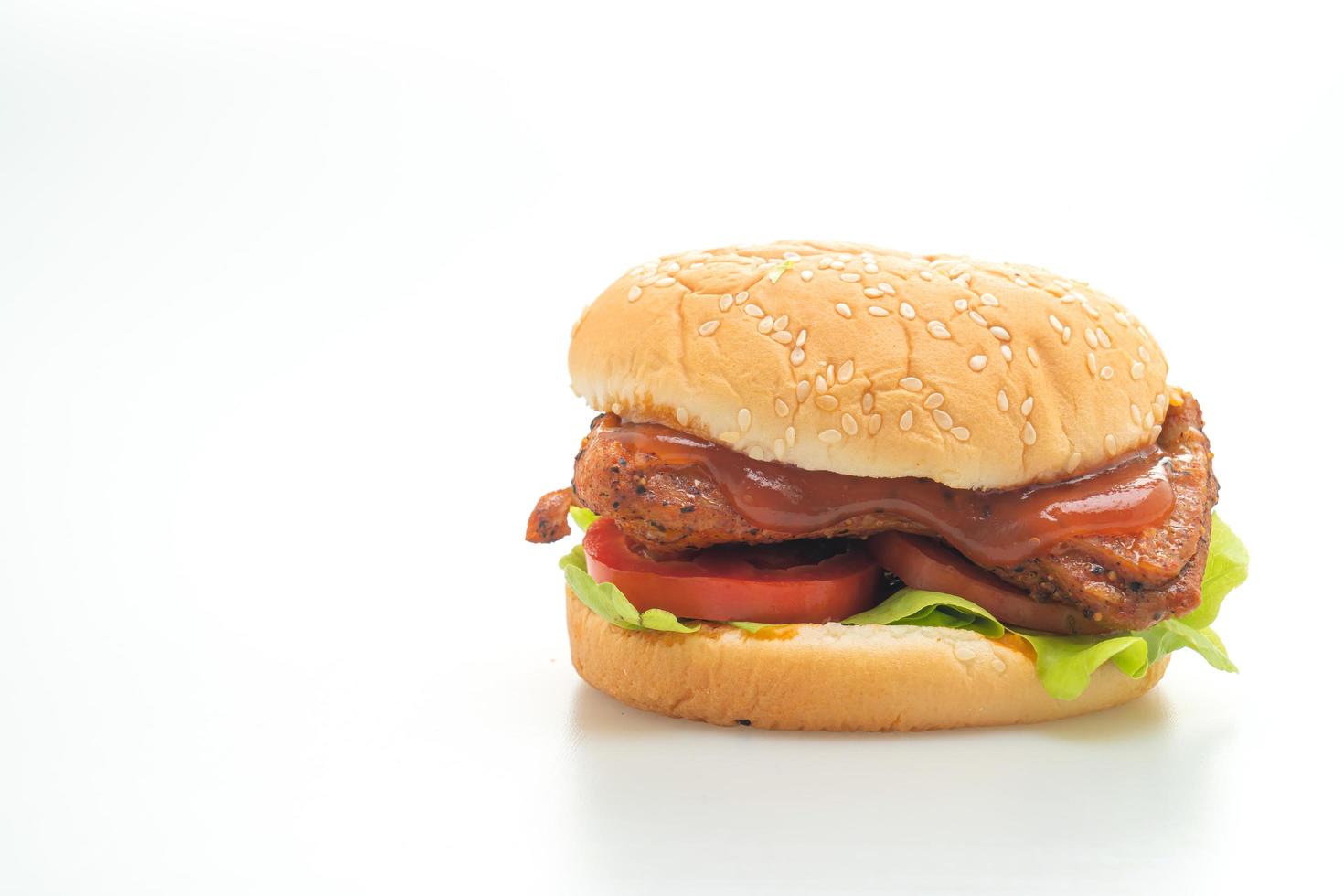 Grilled chicken burger with sauce isolated on white background photo