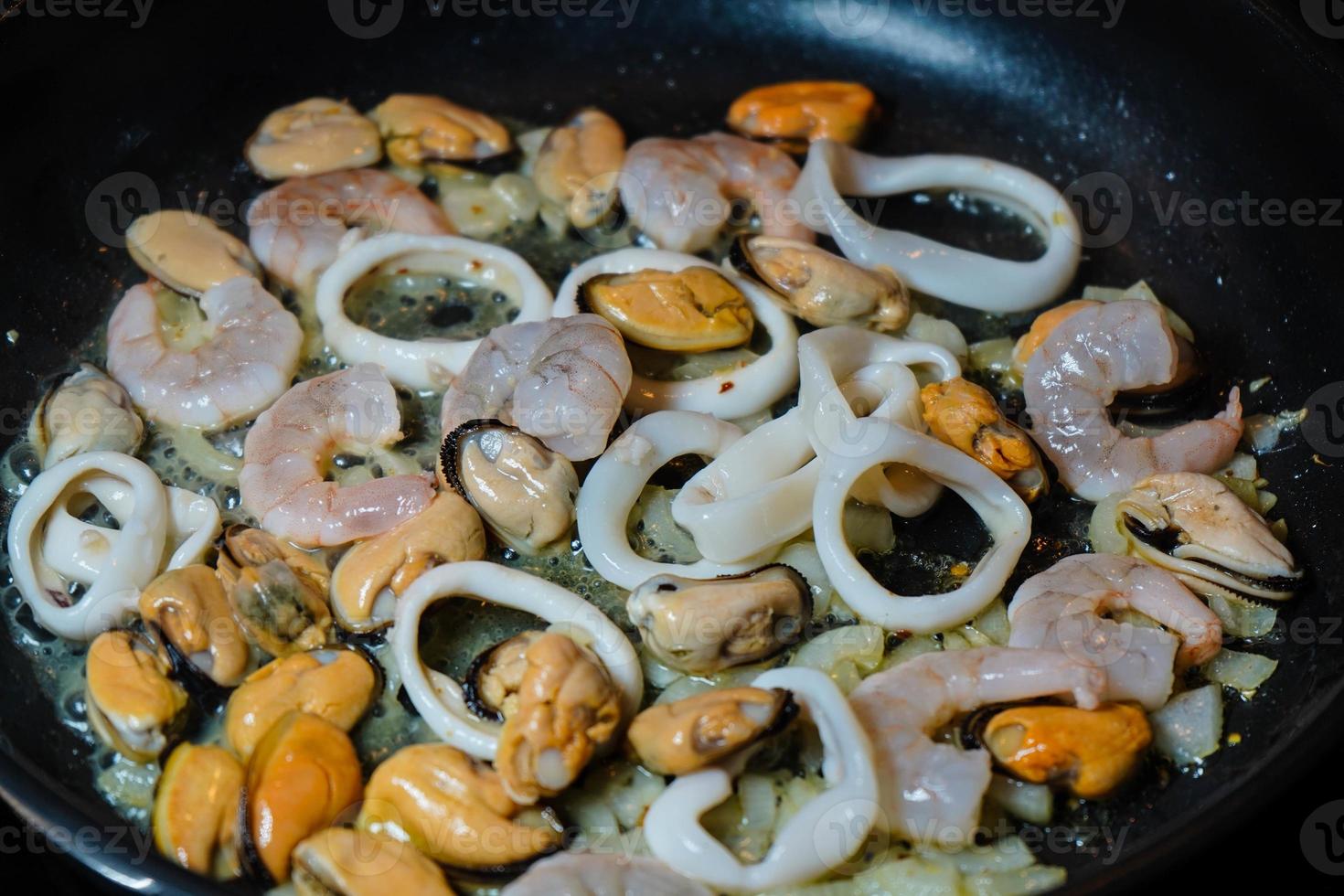 Spaghetti Rigate - black pasta with mixed seafood photo