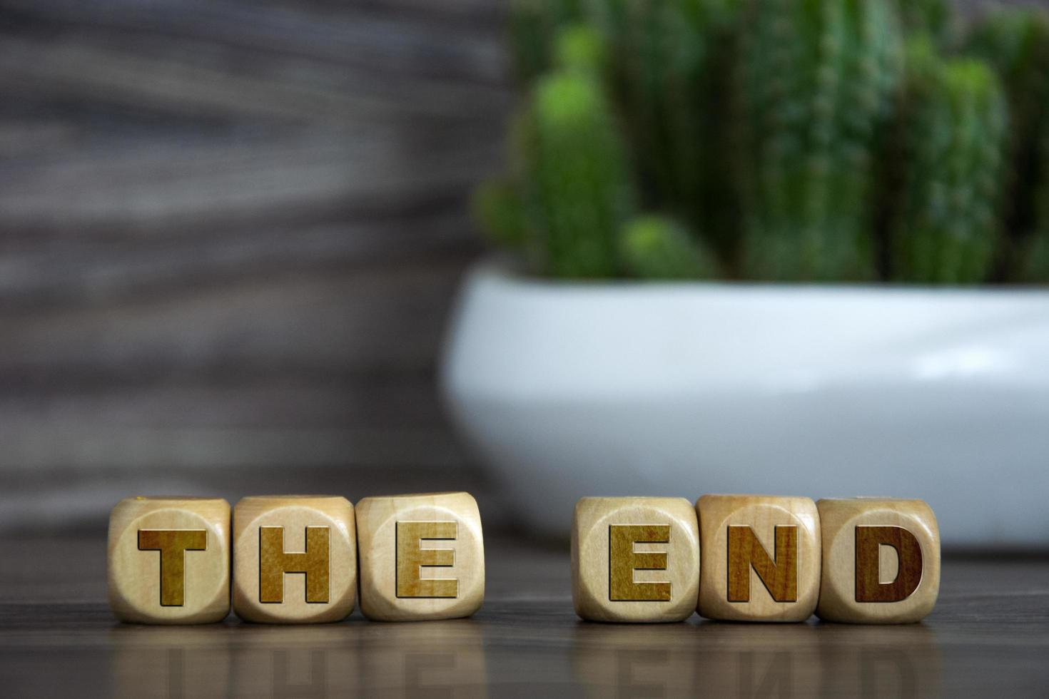 The end spelled in wooden blocks photo