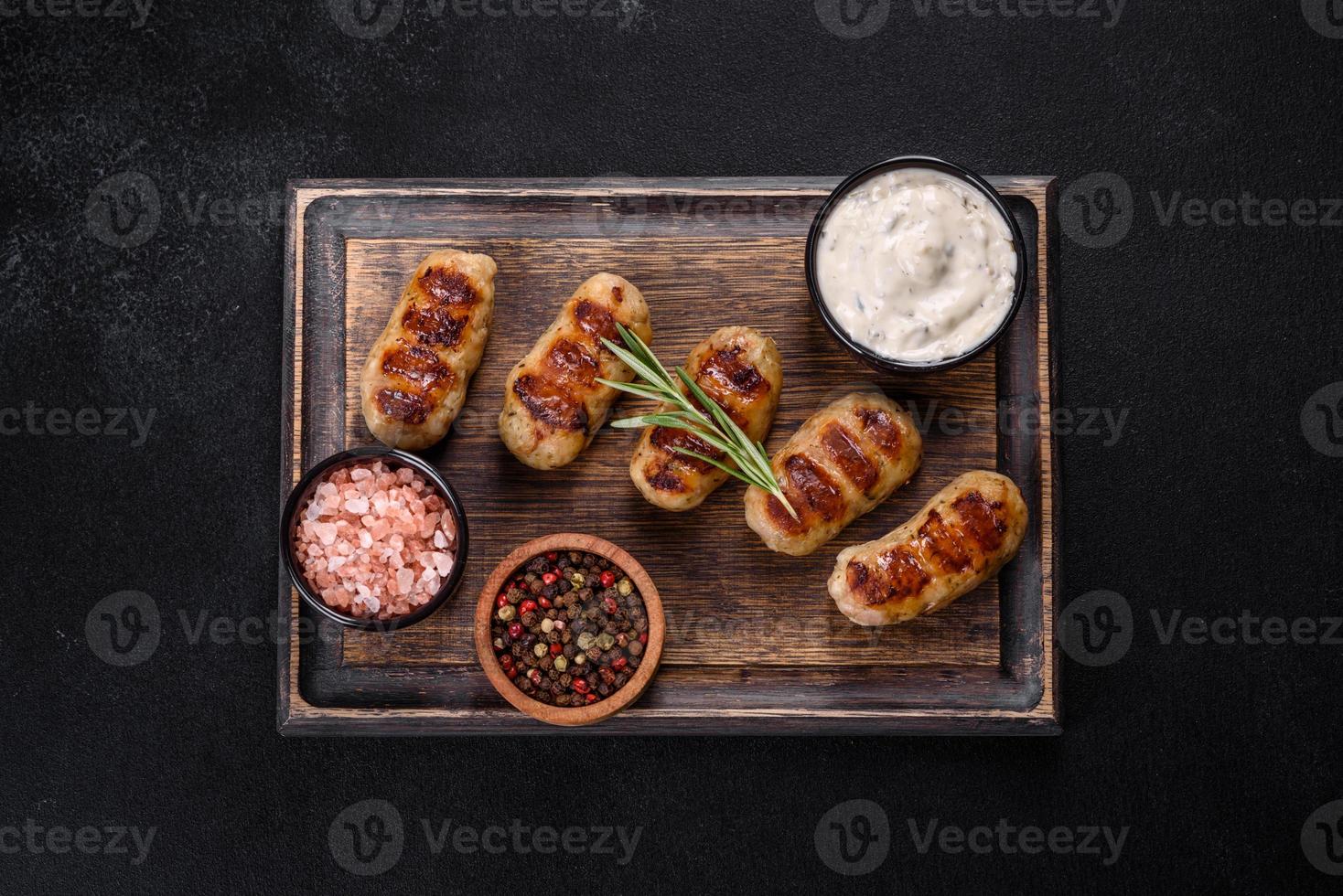 Grilled sausage with the addition of herbs and vegetables photo