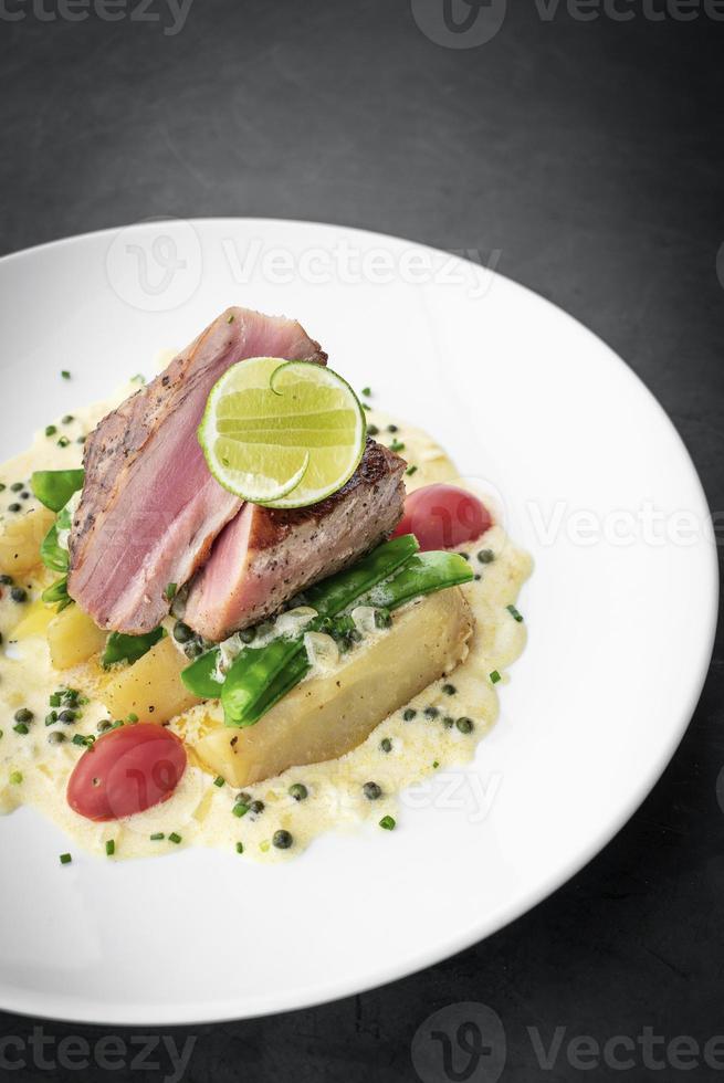 Fresh seared tuna steak with creamy mustard and Kampot pepper sauce photo