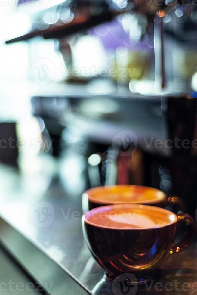 Making espresso coffee close up detail with modern cafe machine photo