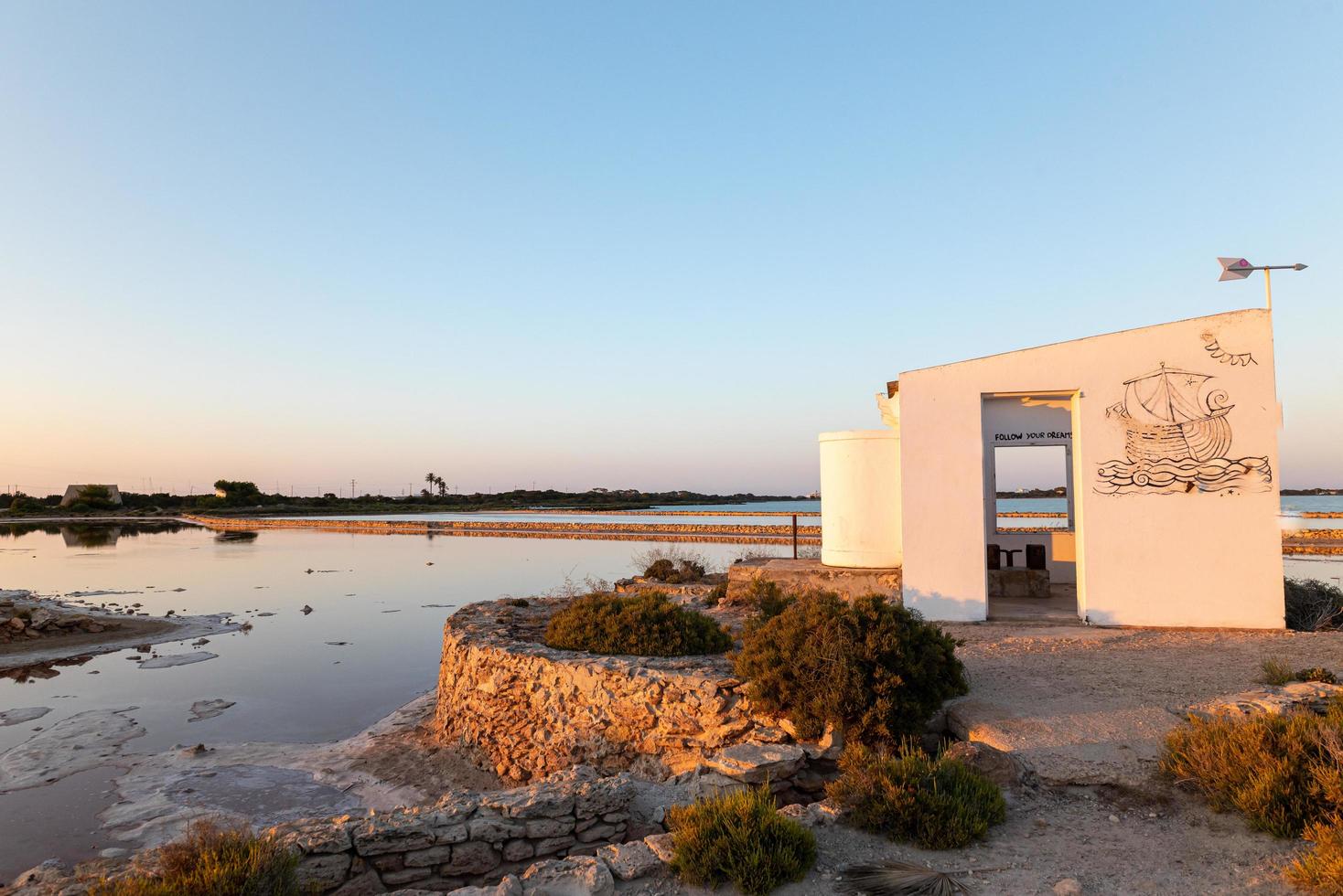 White house with message Follow yours Dreams, in Las Salinas. photo