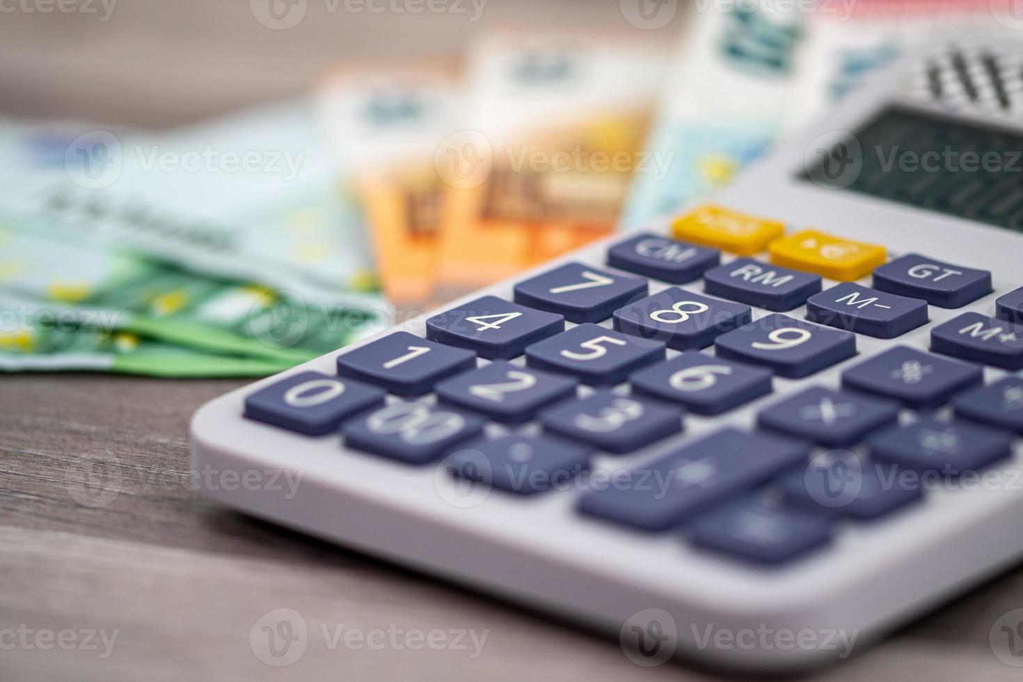 50 100 euro banknotes with calculator photo