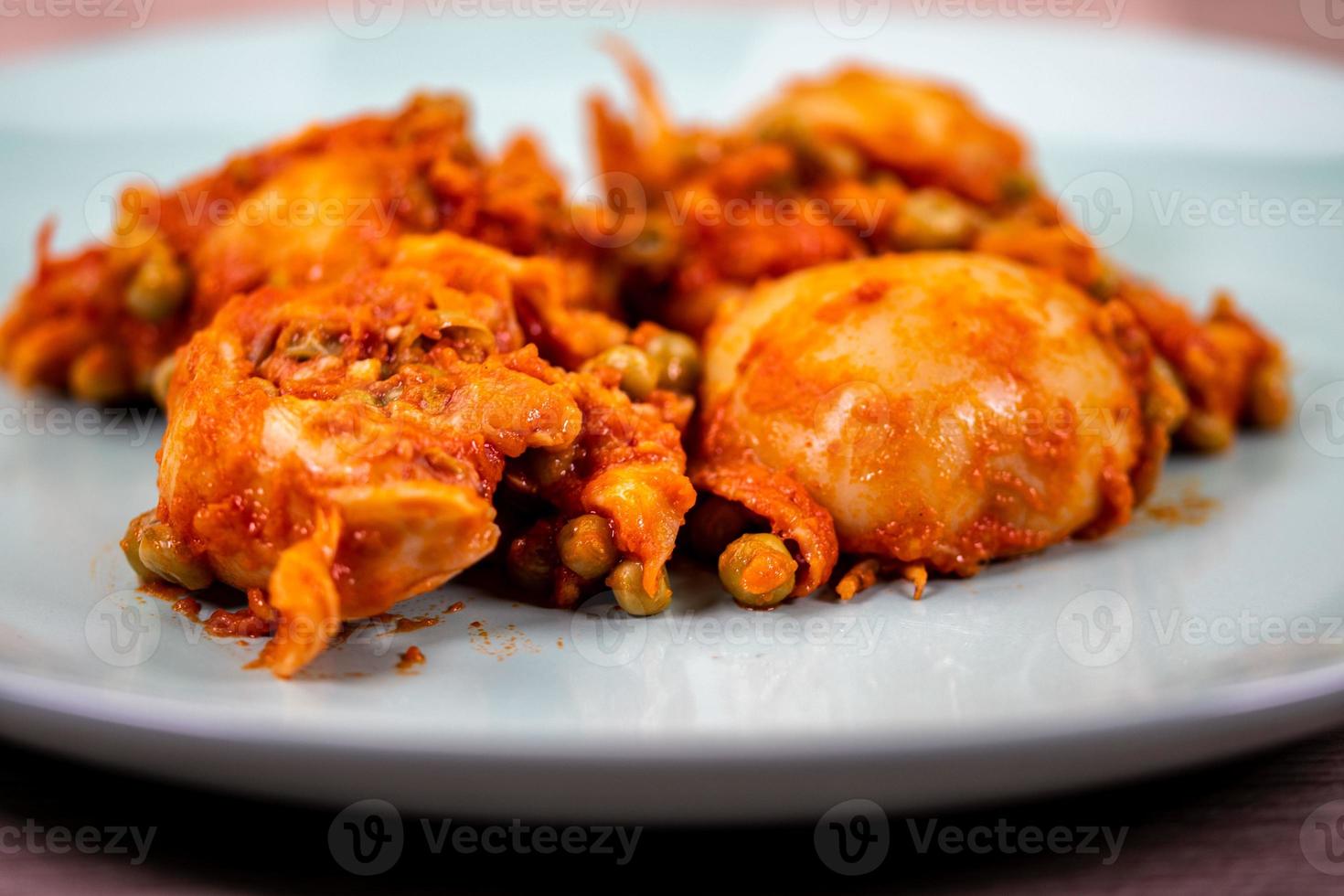 cuttlefish with peas on a plate with sauce photo