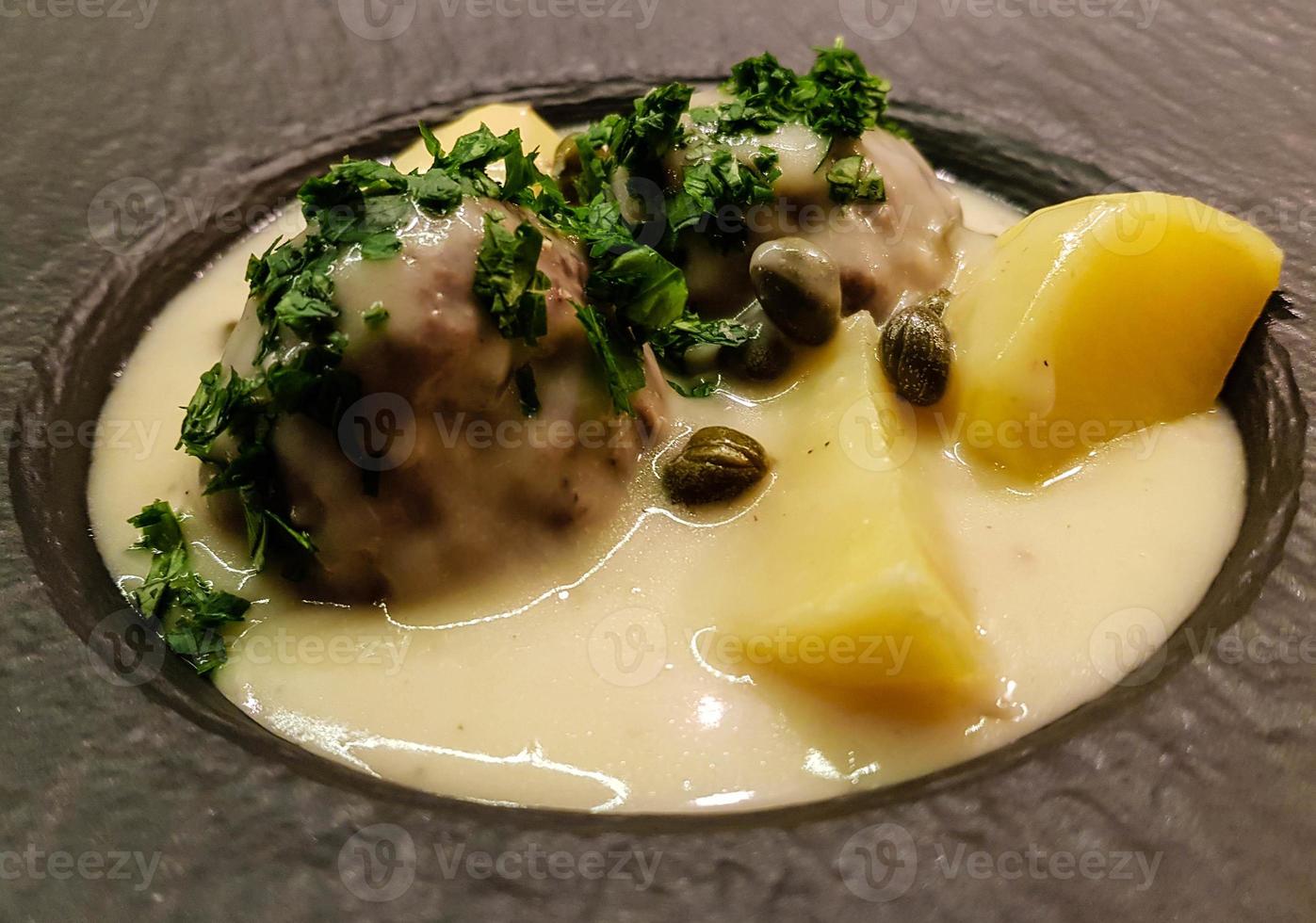 Koenigsberger Klopse meatballs and potatoes with caperberries sauce photo