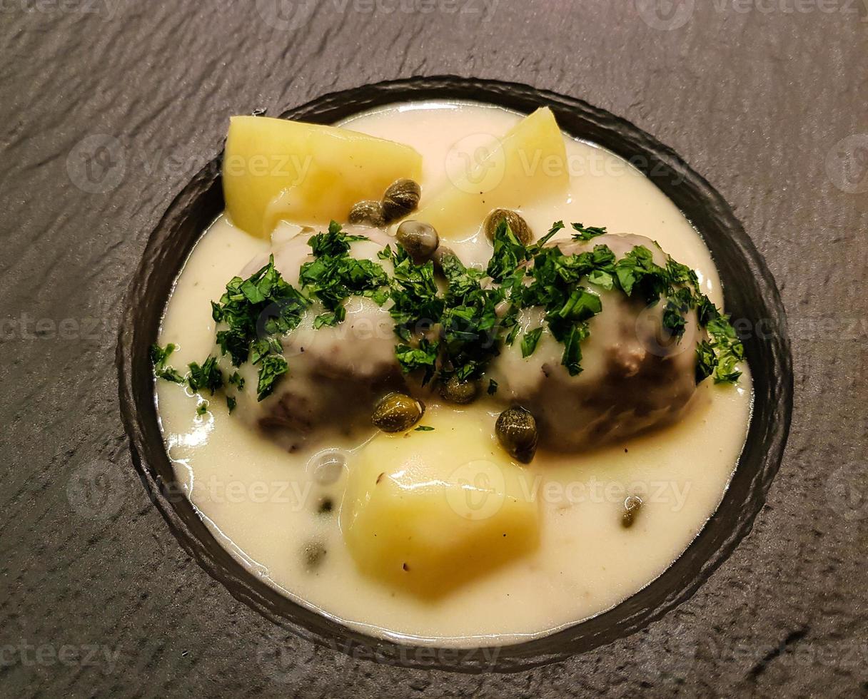 Koenigsberger Klopse meatballs and potatoes with caperberries sauce photo