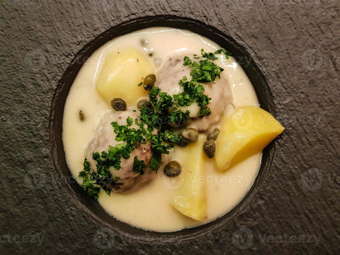 Koenigsberger Klopse meatballs and potatoes with caperberries sauce photo