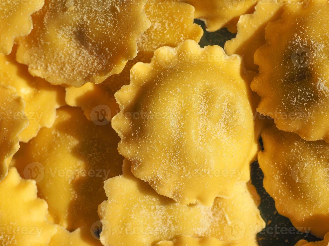 Agnolotti pasta filled with cheese and vegetables photo