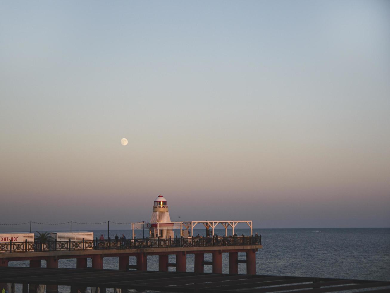 Sunset, Lighthouse in the seafront of Adler city photo