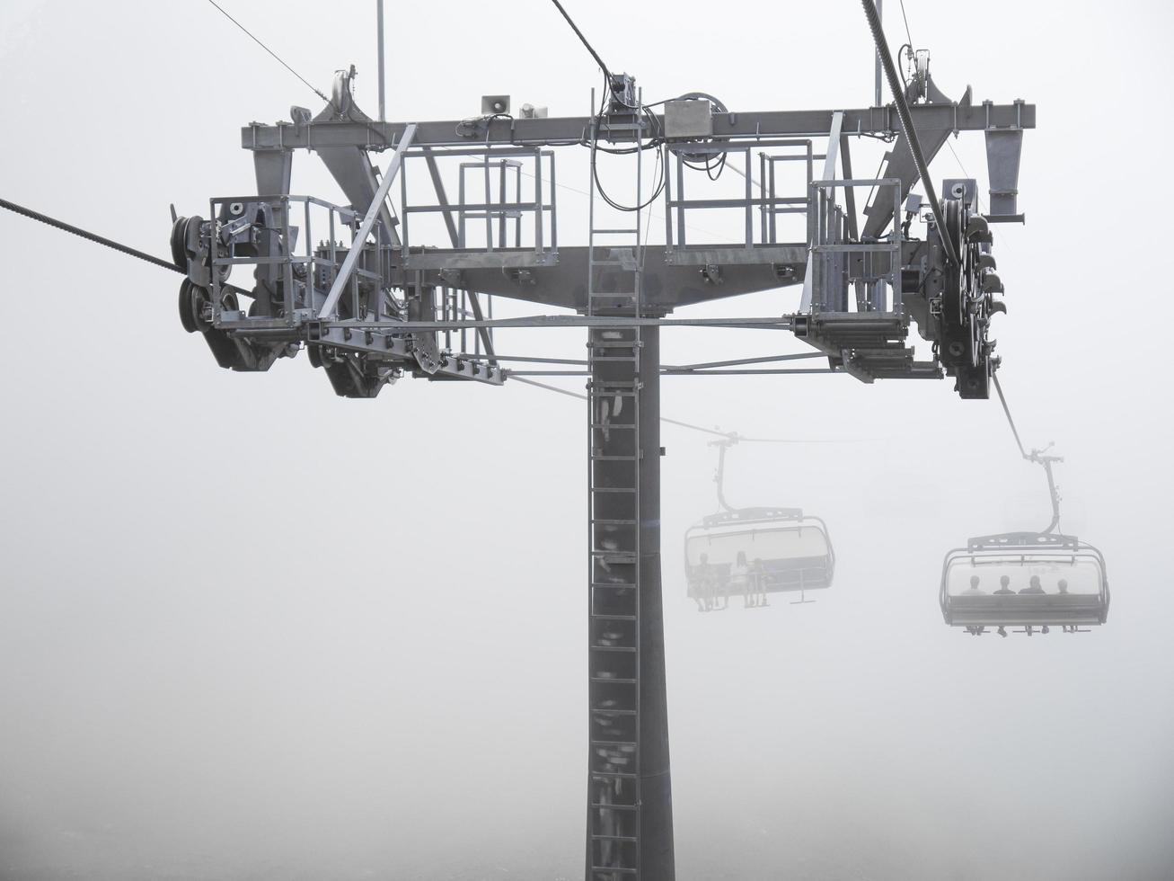 The cable car in fog. Caucasus mountains. Sochi area, Russia photo