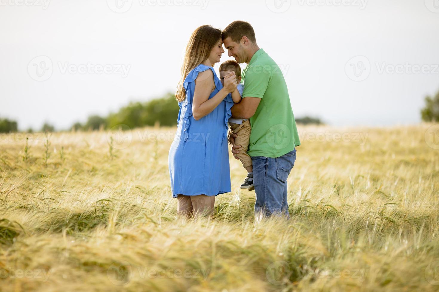 Romantic couple holding hands in a field photo