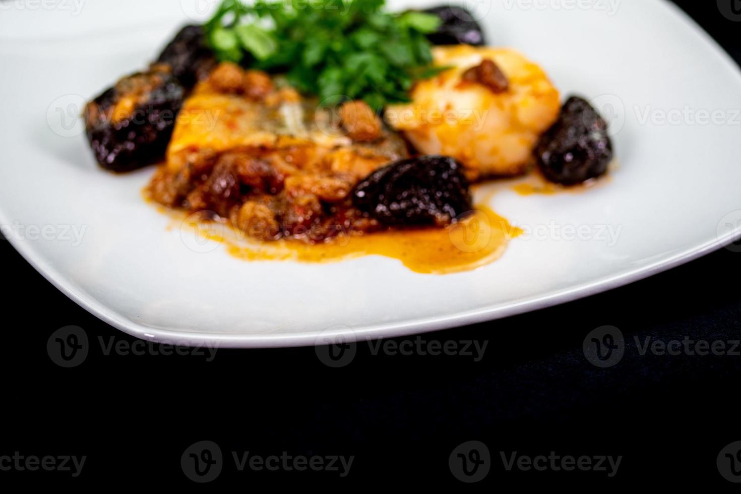 plate of sweet and sour cod on white plate photo