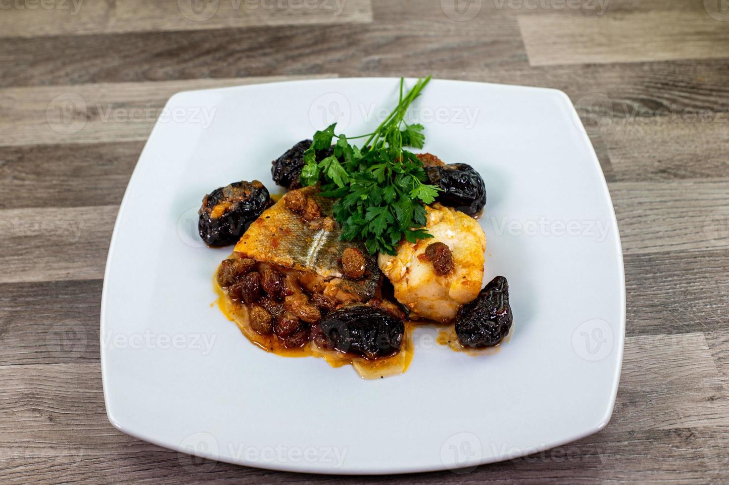 plate of sweet and sour cod on white plate photo