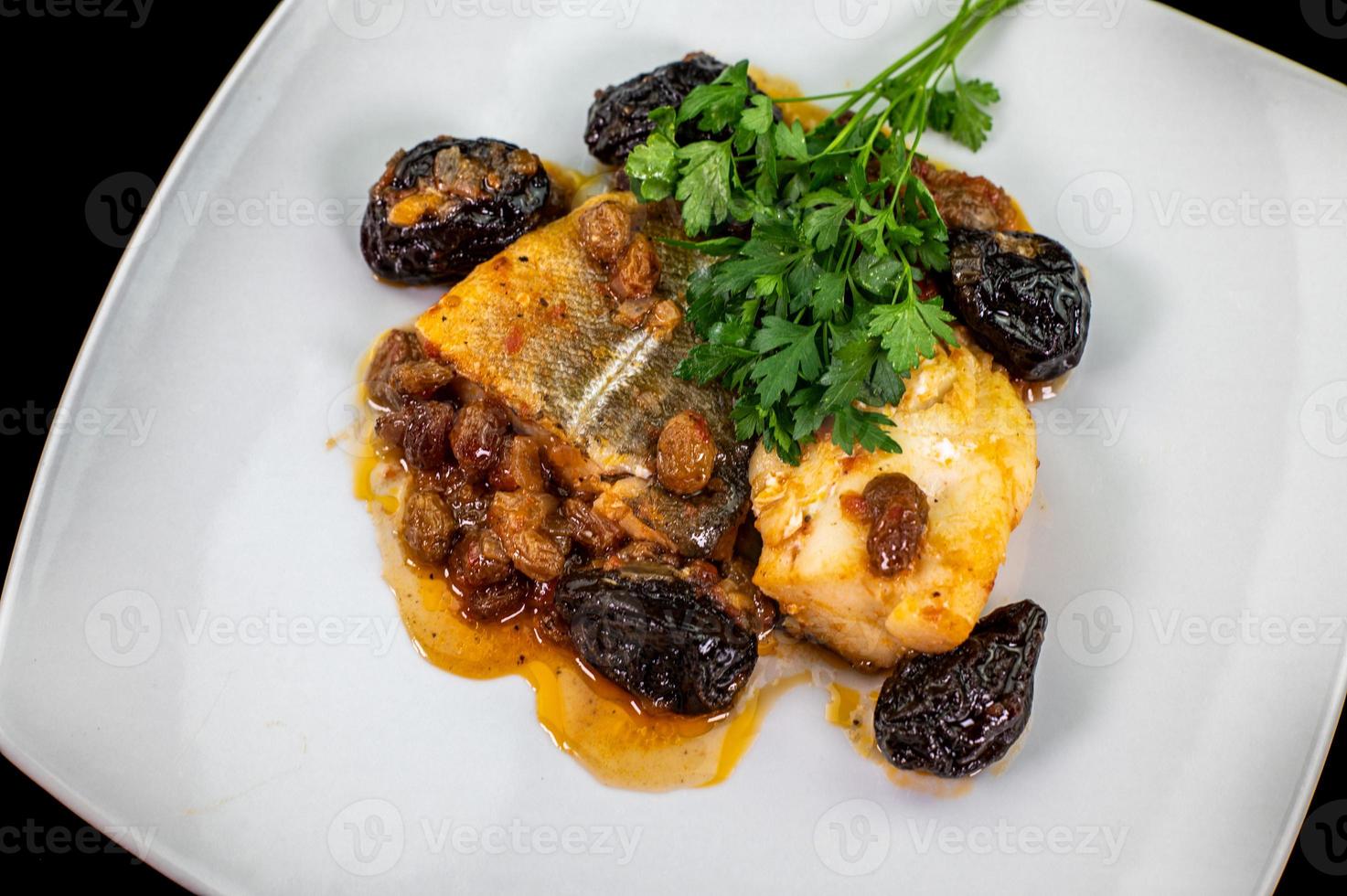 plate of sweet and sour cod on white plate photo