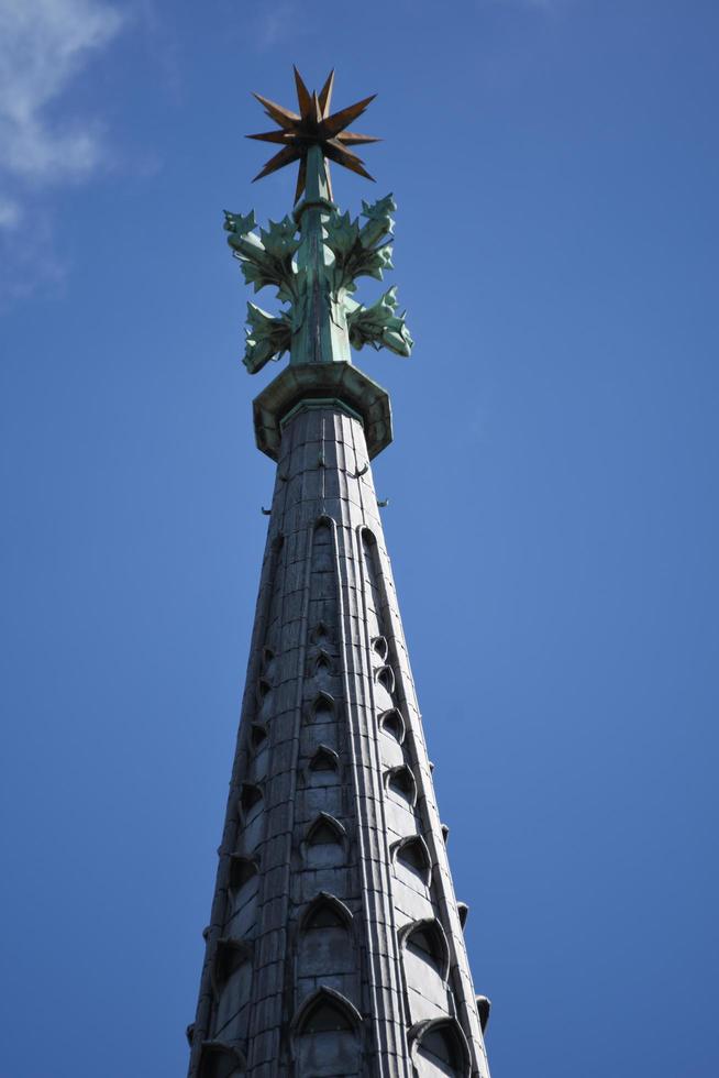 Cologne Cathedral Tower and airplane vapor trails in Germany photo