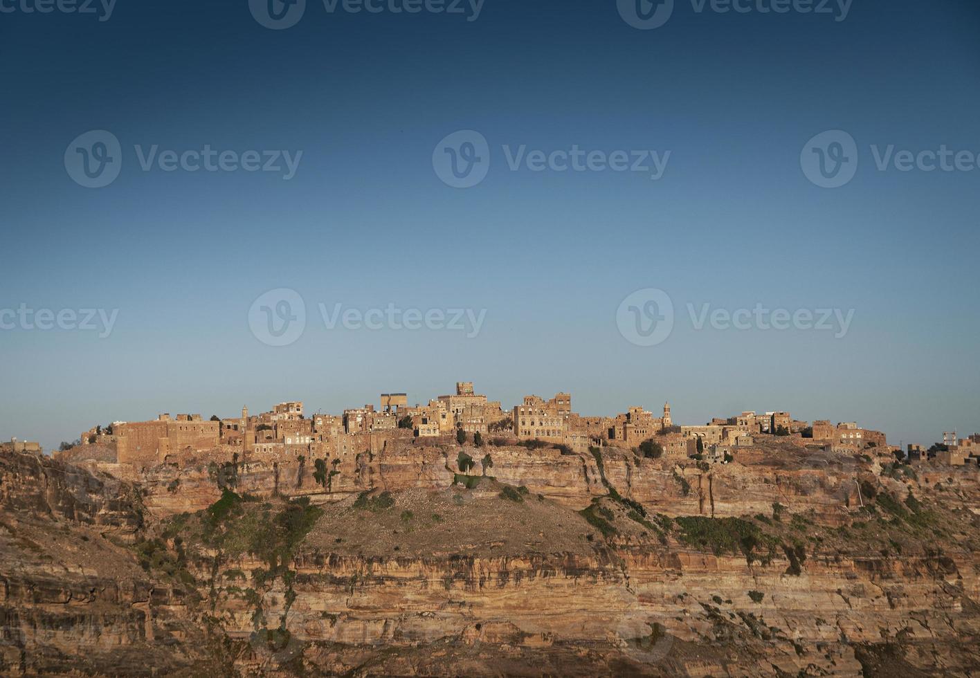 Kawkaban ancient traditional architecture hilltop village in Hartz mountains of Yemen photo