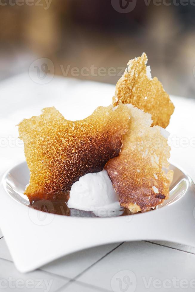 Madagascar vanilla gourmet ice cream with toasted sweet milk chips dessert photo