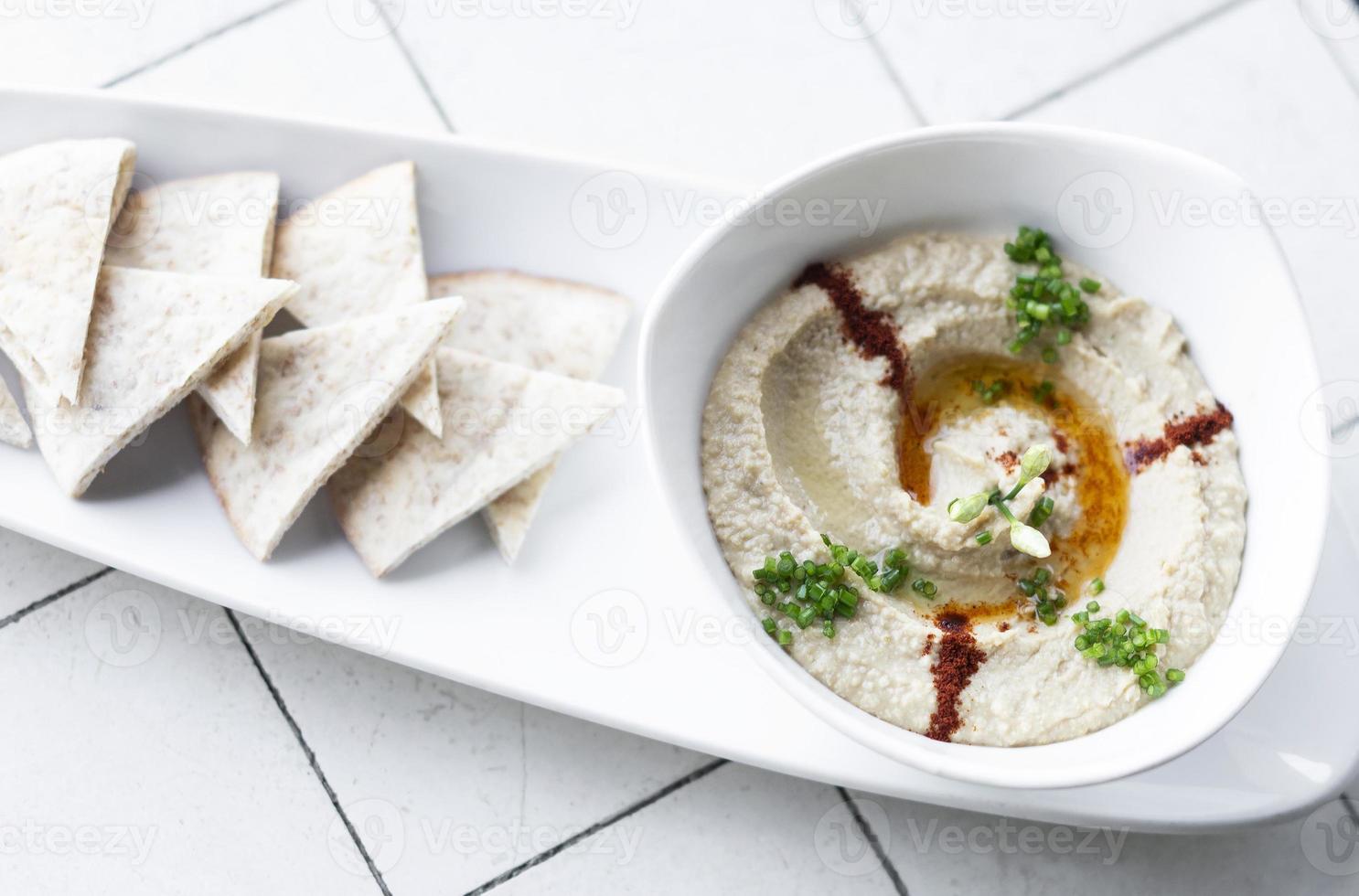 Organic Middle Eastern hummus dip and pita bread set snack in Tel Aviv Israel photo