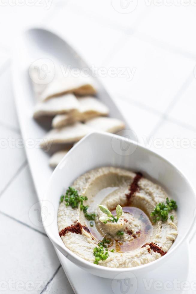 Organic Middle Eastern hummus dip and pita bread set snack in Tel Aviv Israel photo