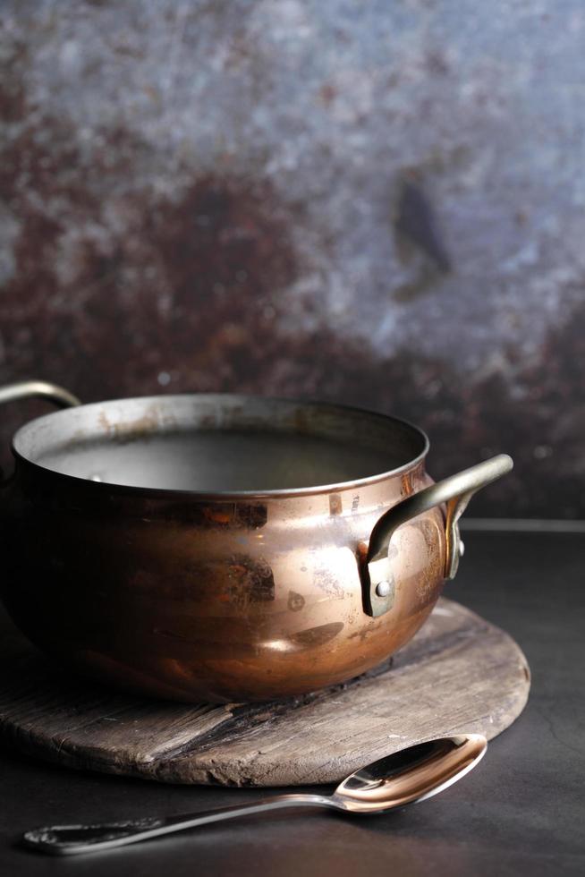 Ancient Moroccan tea pot on a wooden tray photo