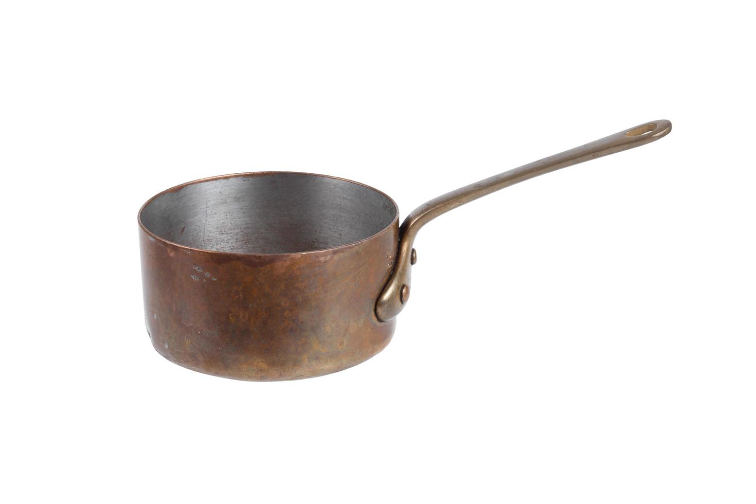 Antique copper sauce pot isolated on white background photo