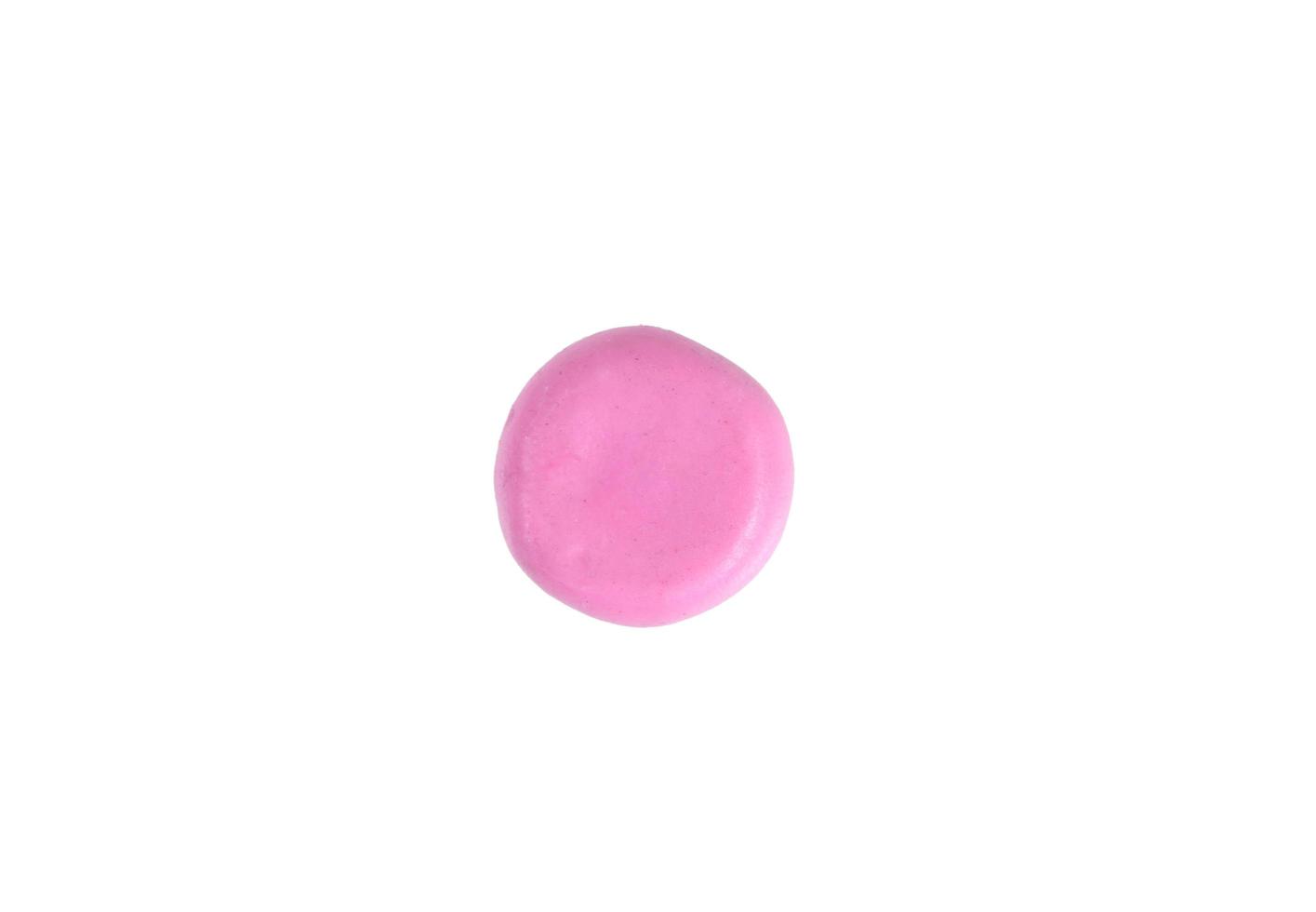 Miniature pink drug model from Japanese clay on white background photo