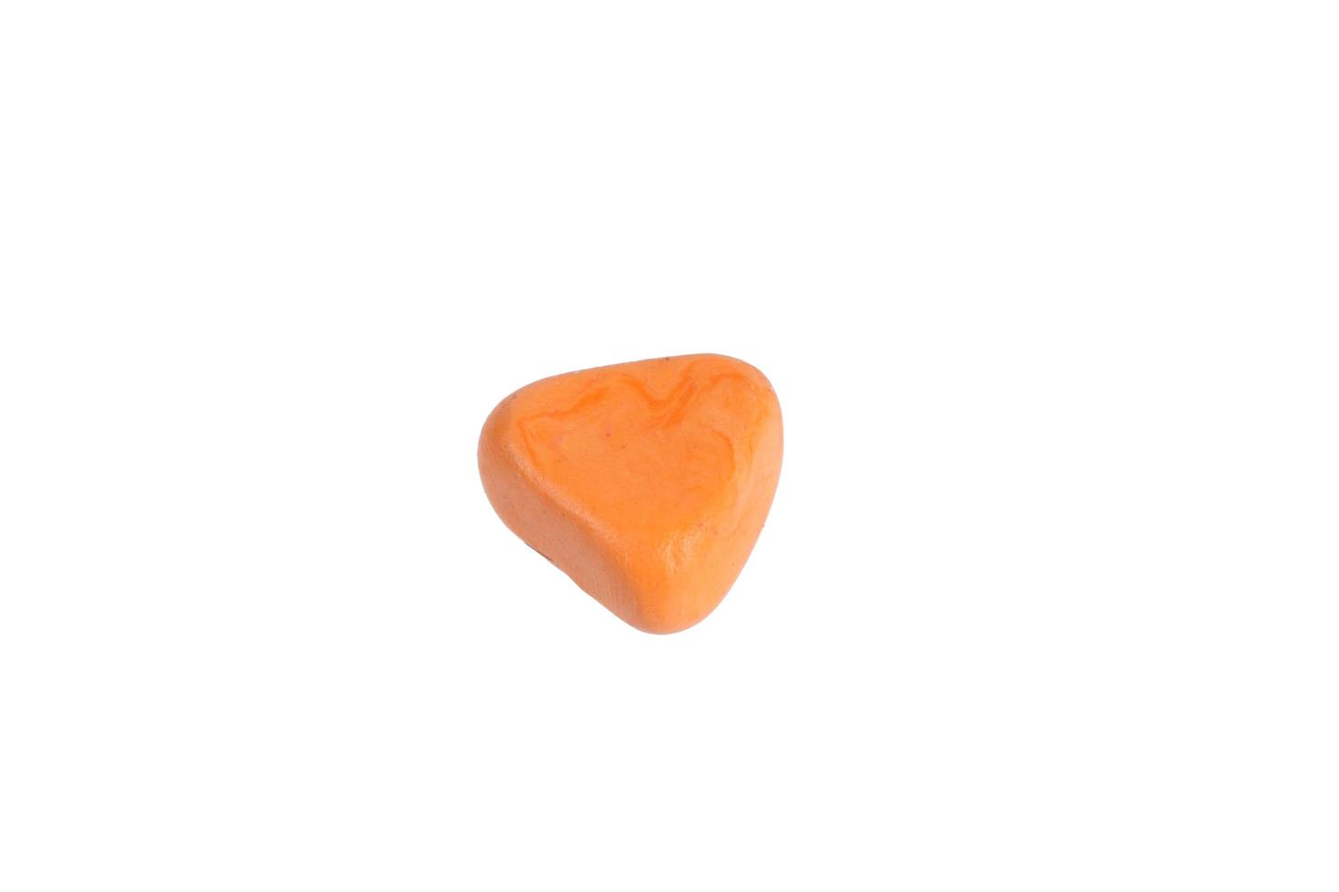 Miniature orange drug model from Japanese clay on white background photo