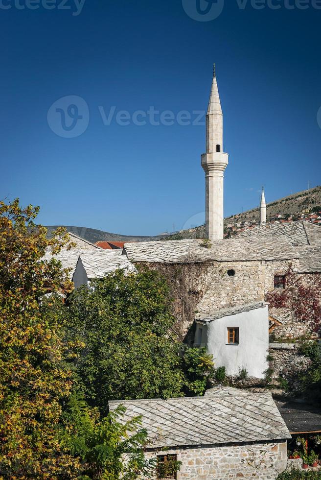 Landmark old town houses and mosque view in Mostar Bosnia photo