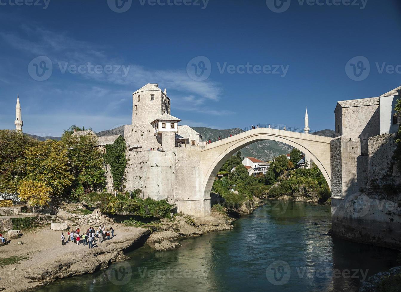 Old bridge famous landmark in Mostar town Bosnia and Herzegovina by day photo