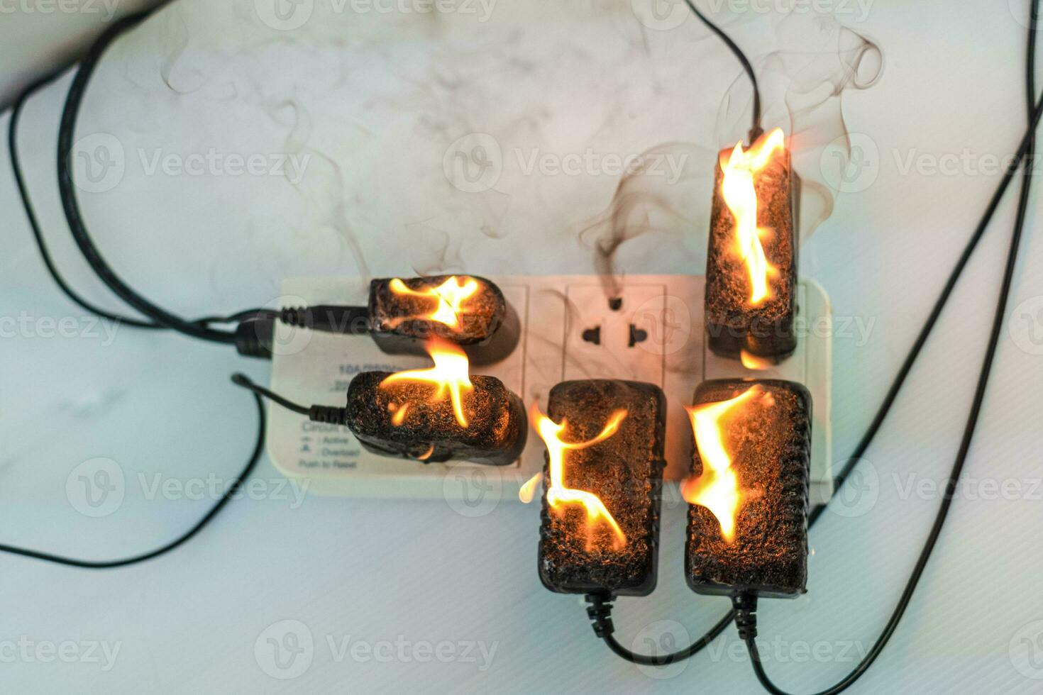 On fire adapter at plug Receptacle on white background photo