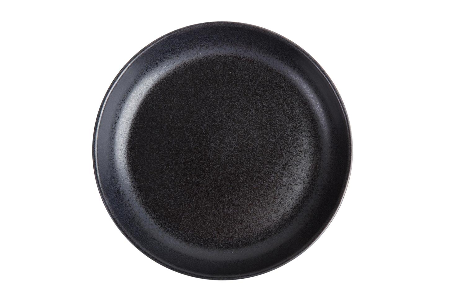 Black ceramic plate on a white background photo