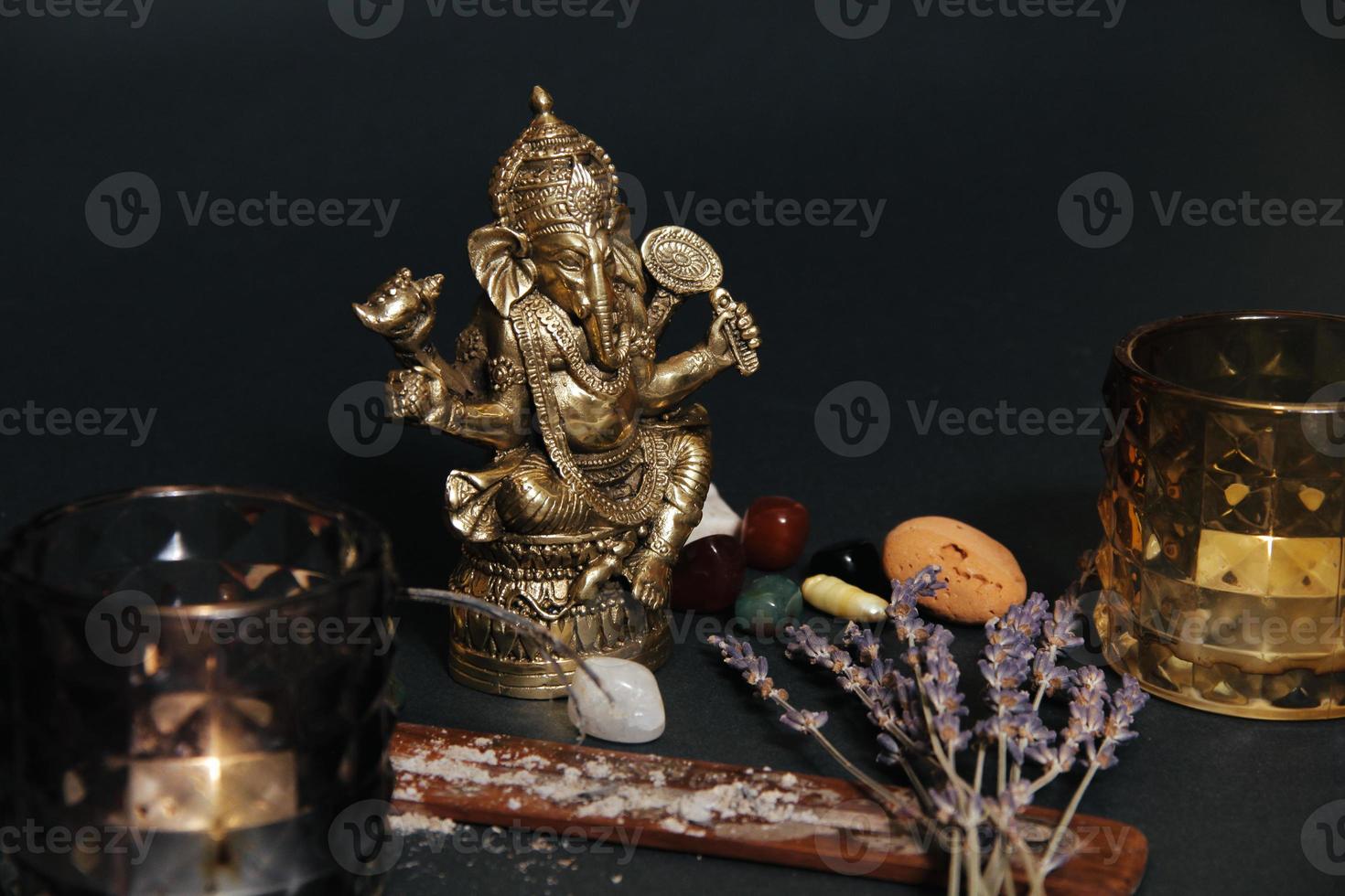 Table with occult attributes, top view. Ganesha figurine, photo