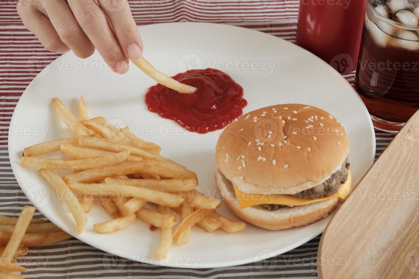 Eating fast foods on the white dish. photo