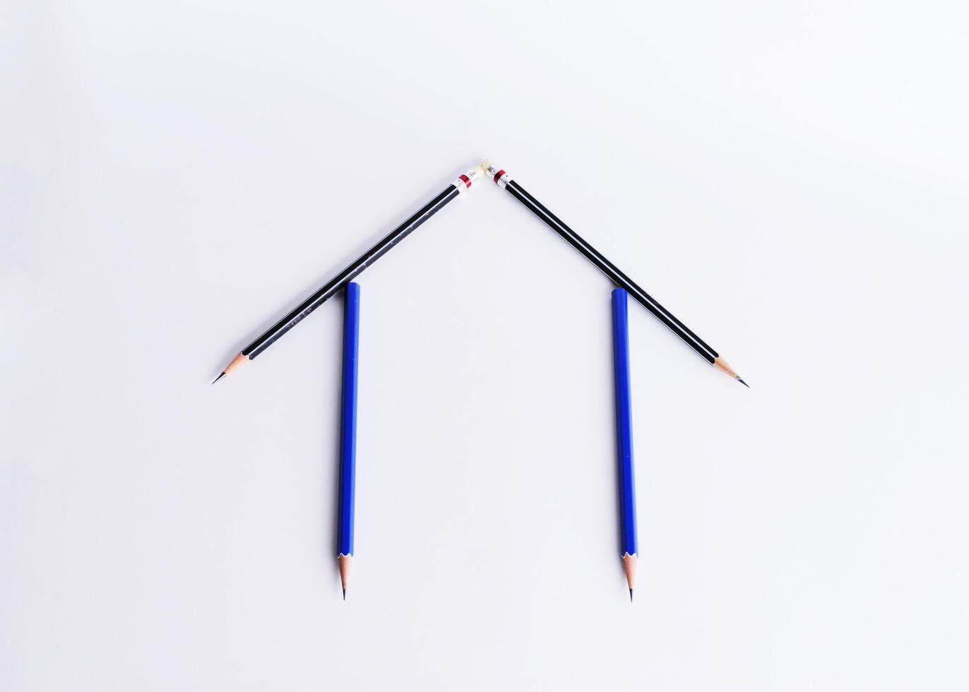 Home concept with pencil on white backgrounds photo