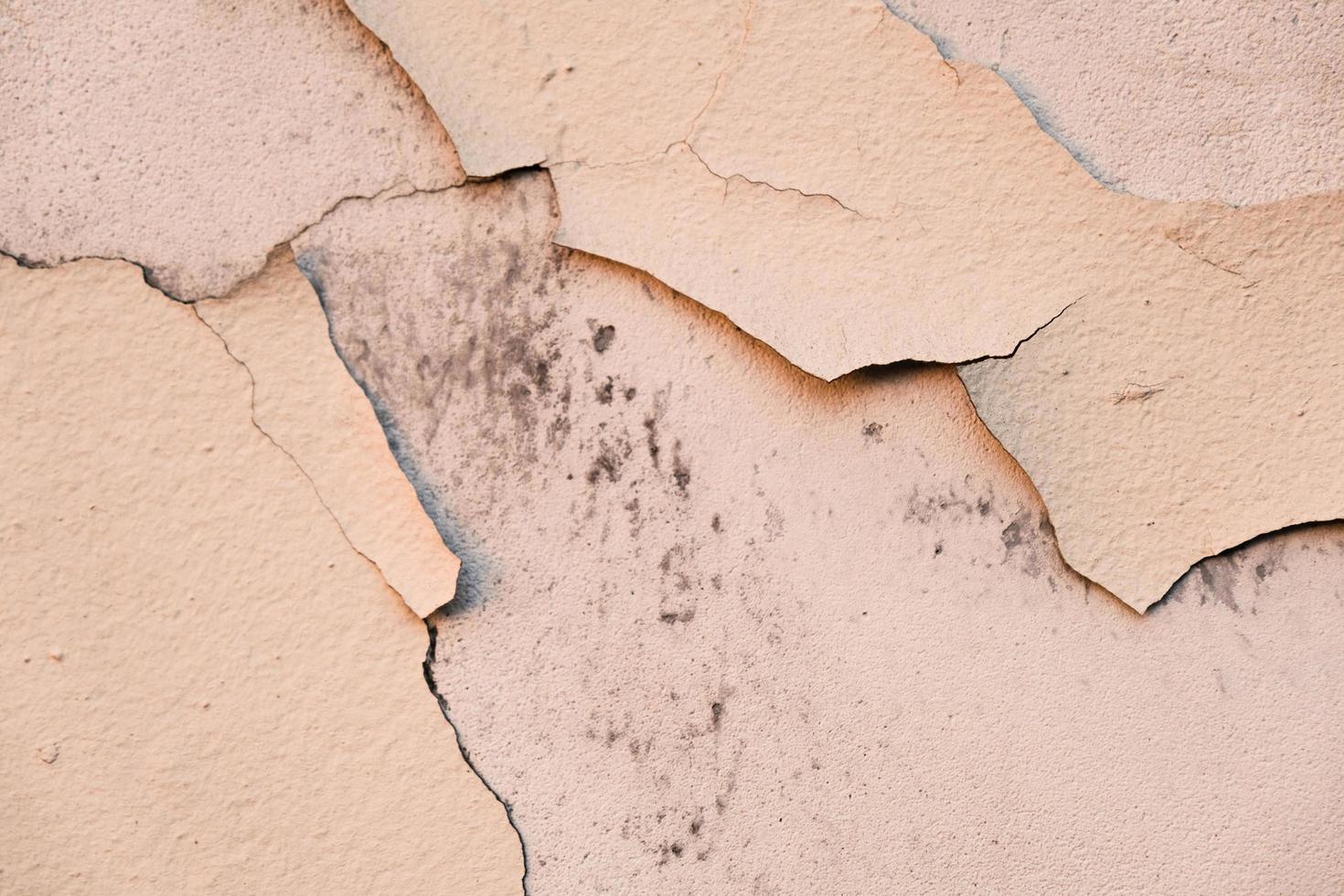 cracked peeling paint on old wall, closeup, background photo