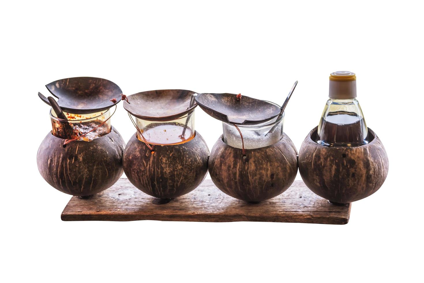 Set of Glass Condiment in A Coconut shell Condiment Holder isolated photo