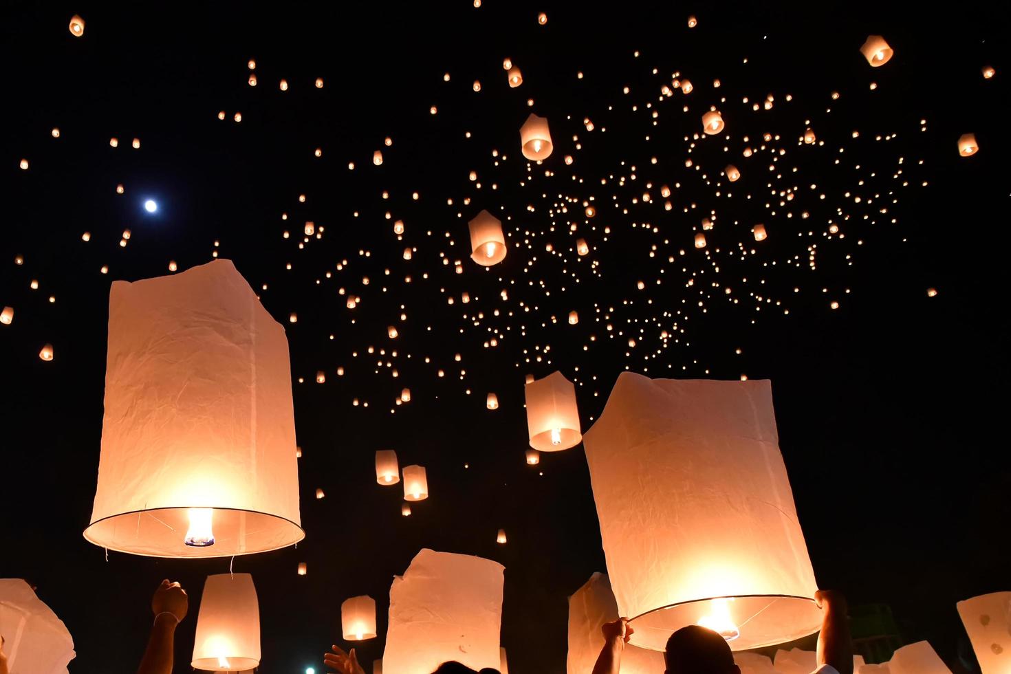 Floating lanterns on sky in Loy Krathong Festival photo