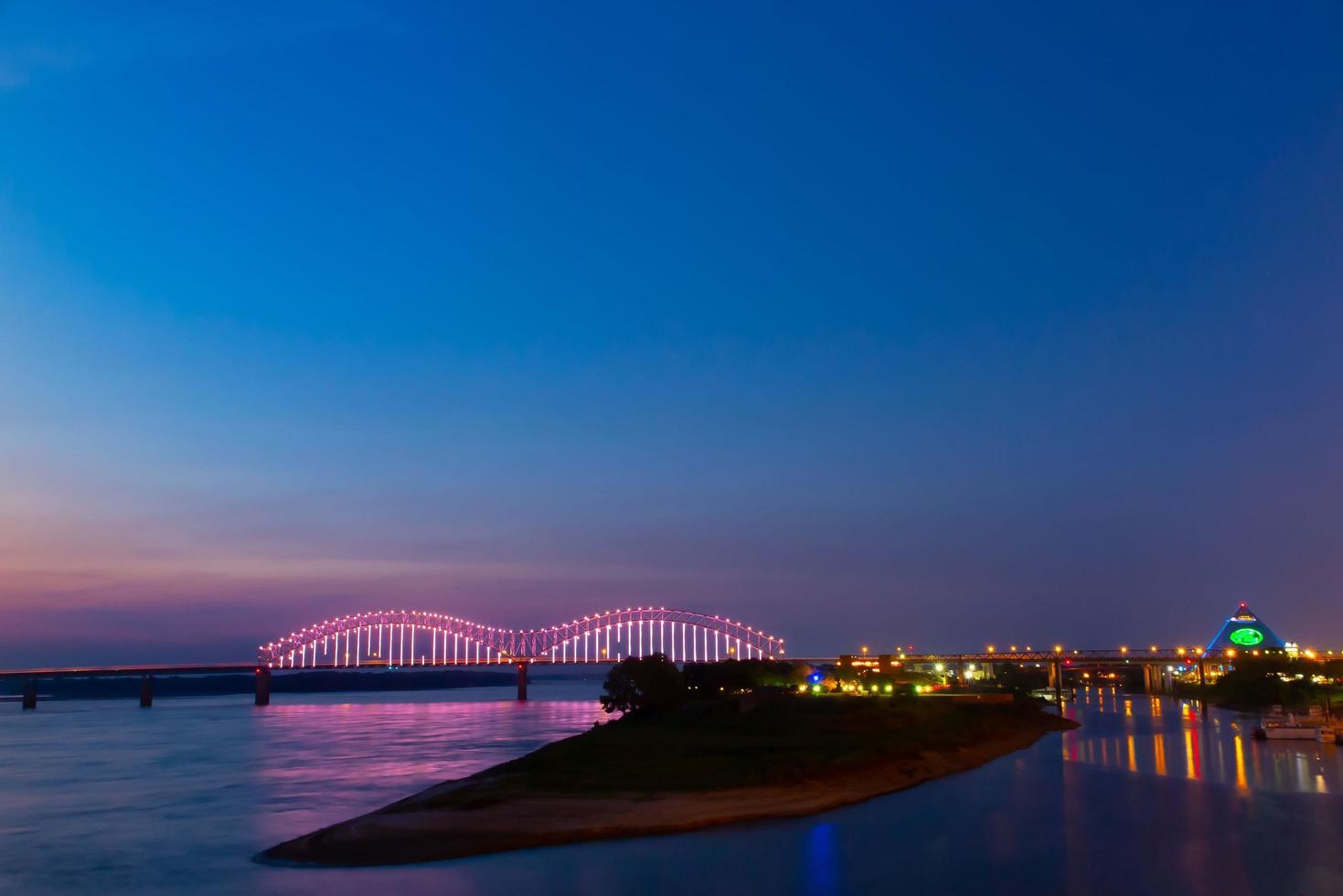 Hernando Desoto Bridge on the Mississippi River at dusk photo