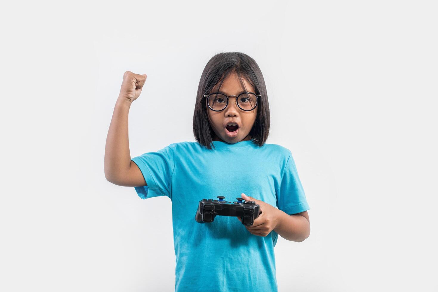 Portrait of little girl with joystick gamer. photo