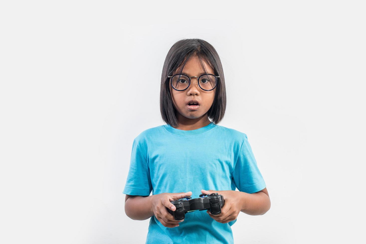 Portrait of little girl with joystick gamer. photo