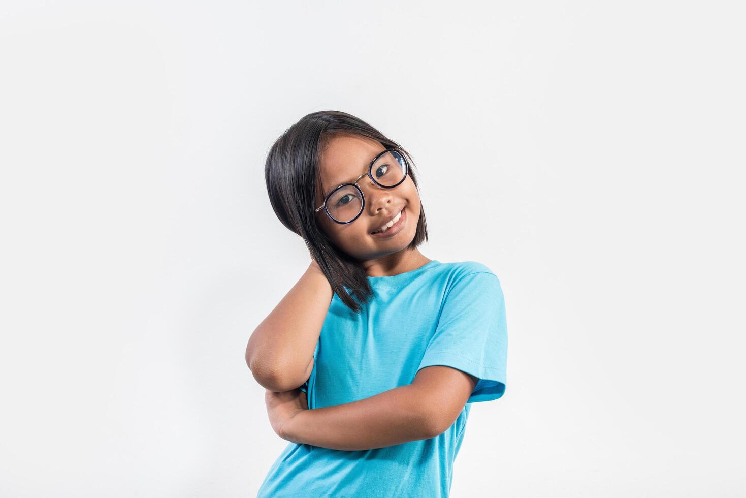 Little girl thinking in studio shot. photo