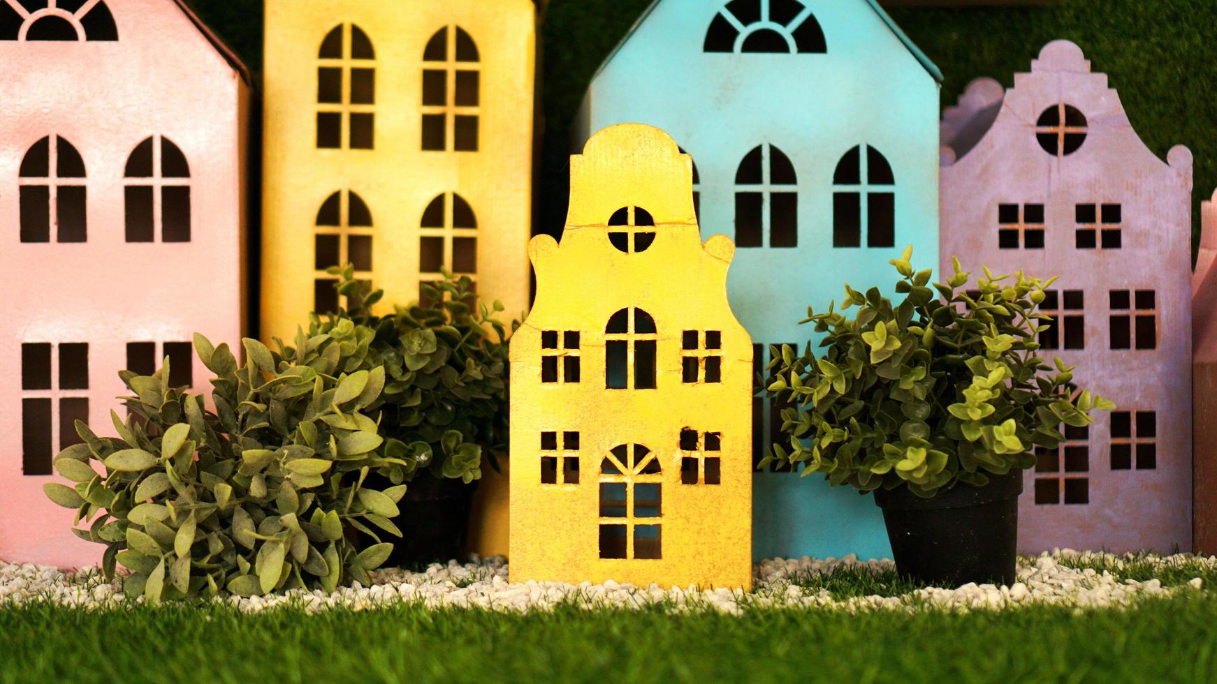 Small cardboard colorful houses made by hand. photo