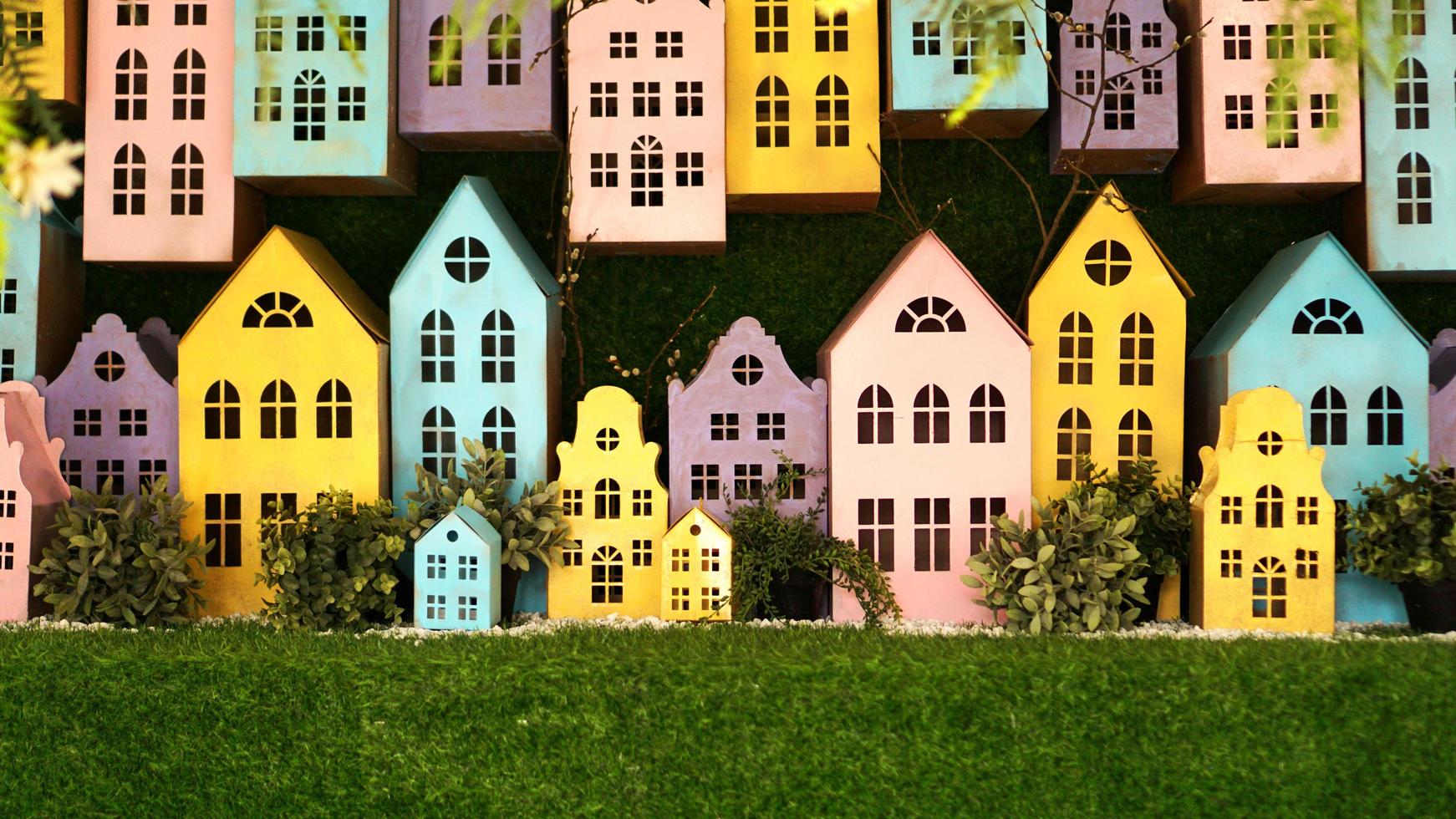 Small cardboard colorful houses made by hand. photo