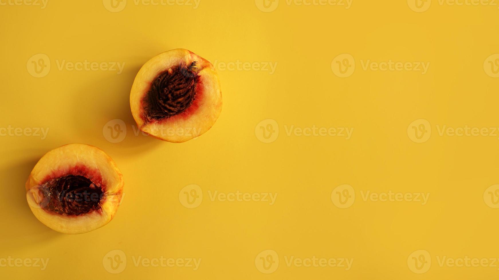 Ripe fresh apricots fruits on yellow background. Flat lay photo