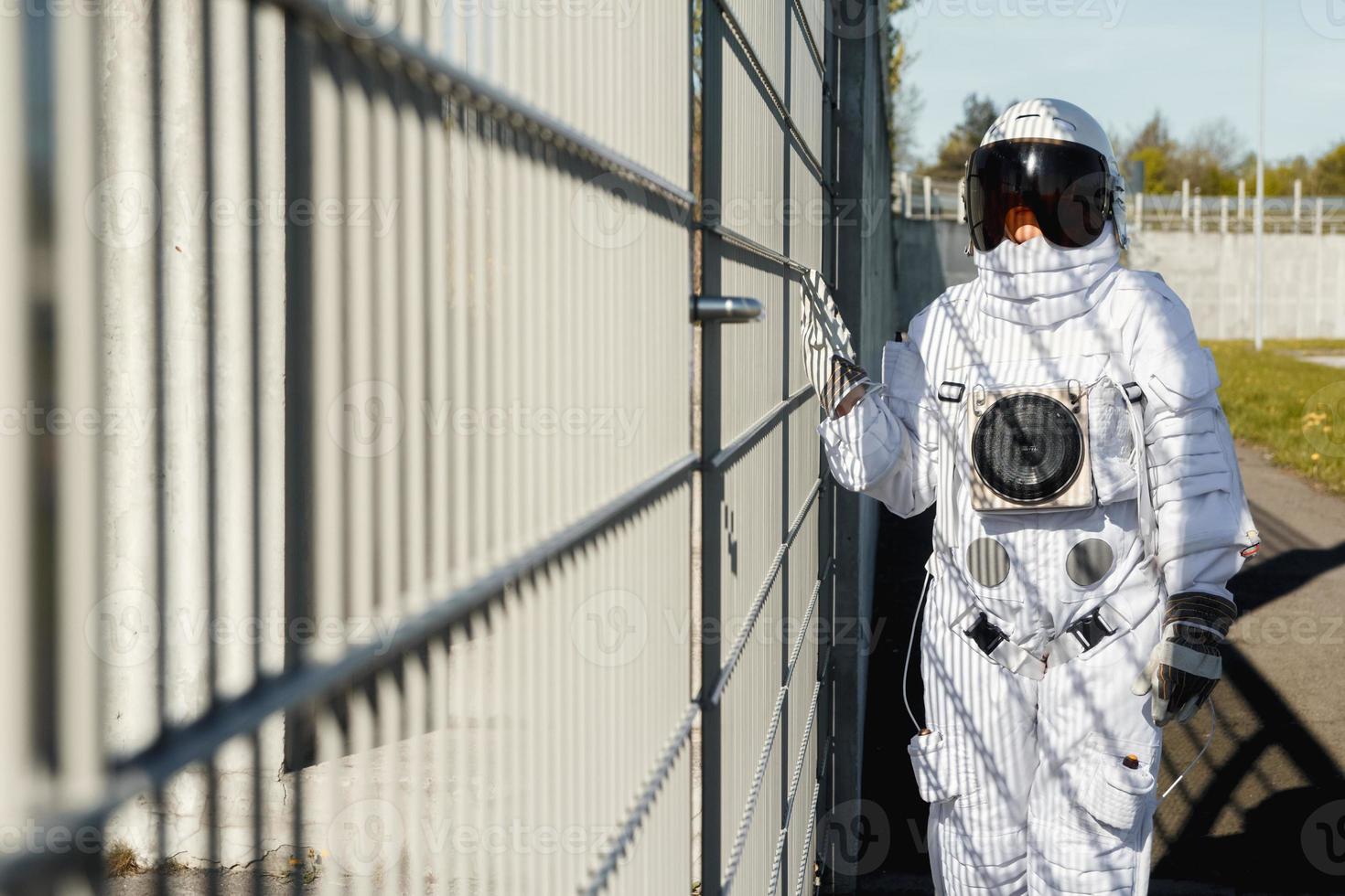 Astronaut on futuristic city background, glimpse at future photo