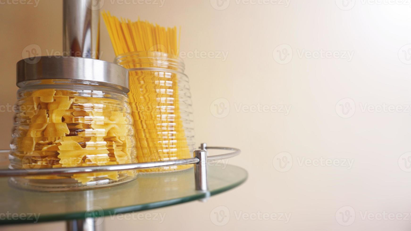 Pasta in a glass jar. Free space for text photo