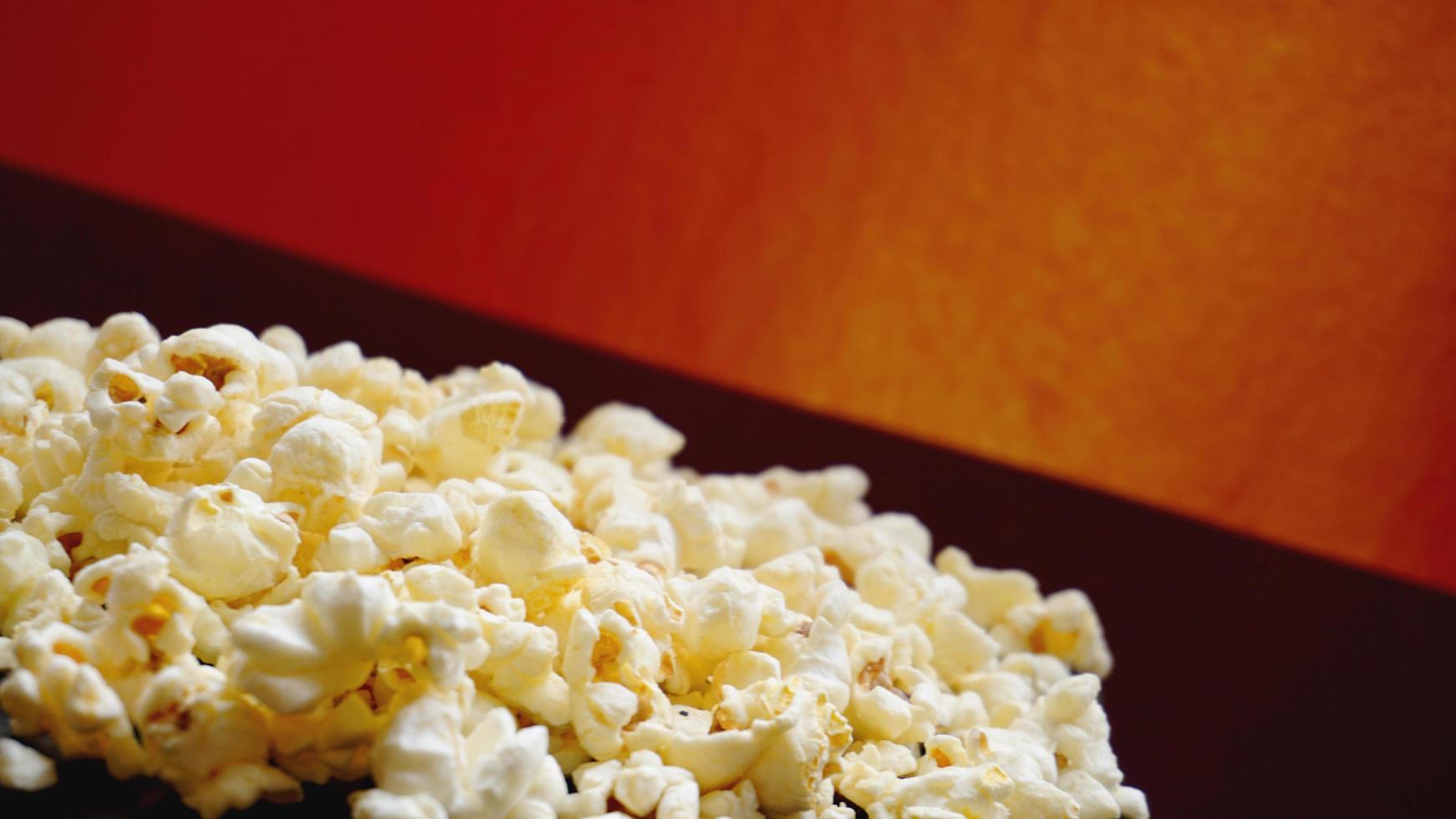 Heap of classic salty popcorn on black background photo