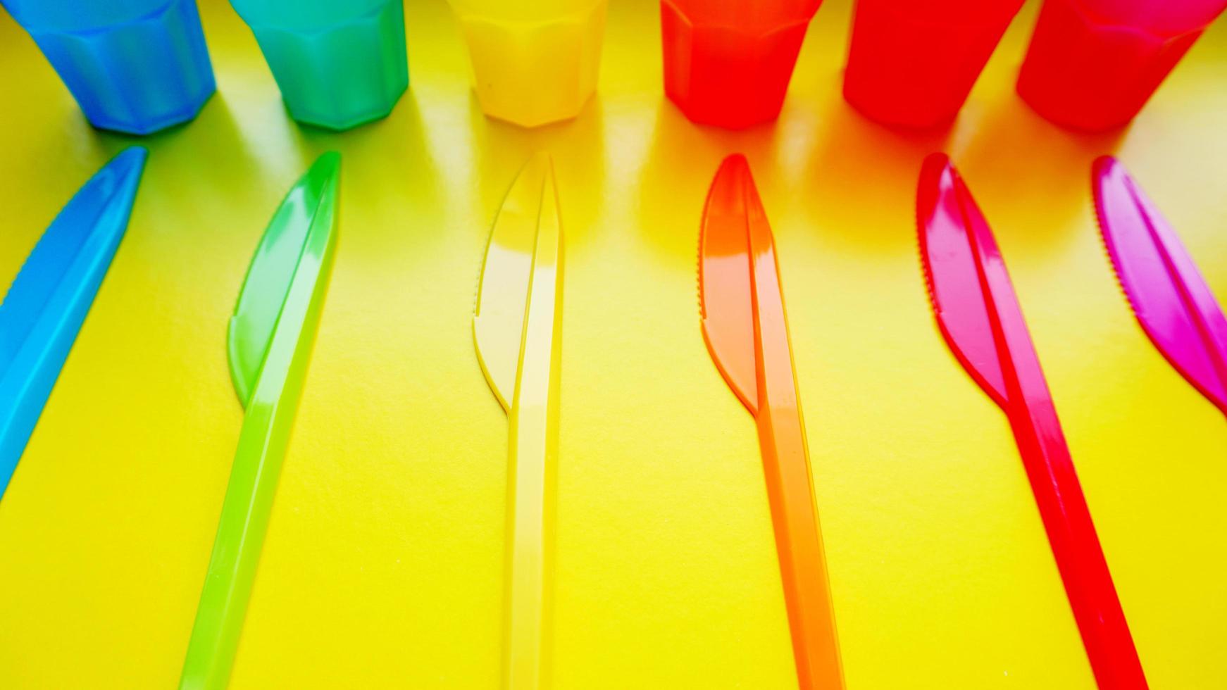 Colored plastic ware. Tableware for a picnic made of colored plastic. photo