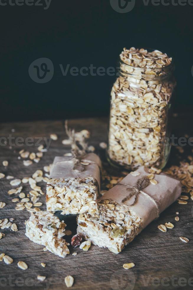 Homemade granola with nut mix on wooden board photo